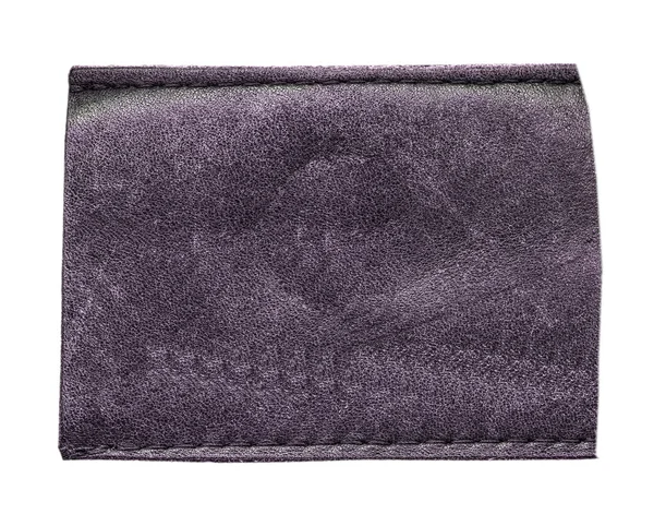 Etiqueta de couro violeta em branco isolado no fundo branco — Fotografia de Stock