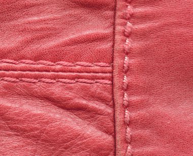 kırmızı deri doku iki dikişleri ile dekore edilmiştir.