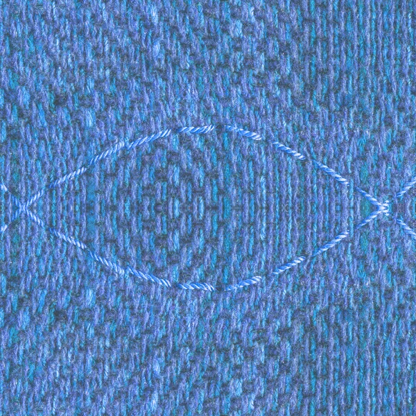 Blauwe textiel textuur versierd met naden — Stockfoto