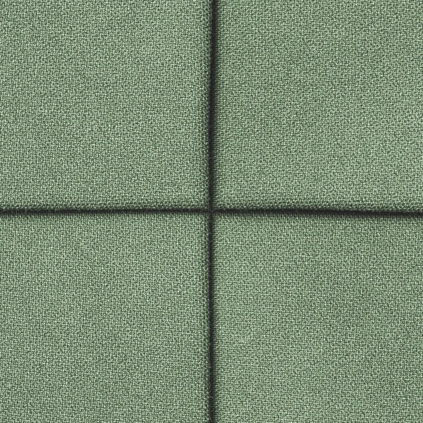 Textura de tecido verde decorado com costuras — Fotografia de Stock