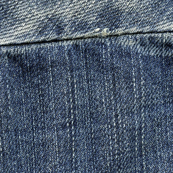 Blue jeans background decorated with seam — Stock Photo, Image