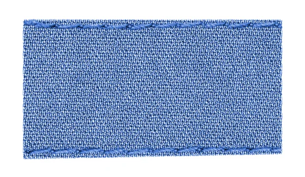 Etiqueta têxtil azul em branco — Fotografia de Stock