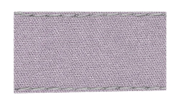 Etiqueta têxtil violeta pálida em branco — Fotografia de Stock