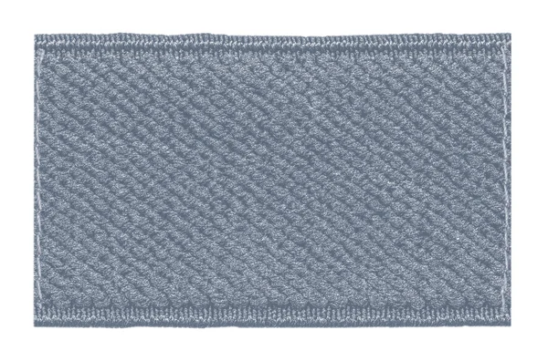 Etiqueta têxtil cinza-azul em branco isolada — Fotografia de Stock