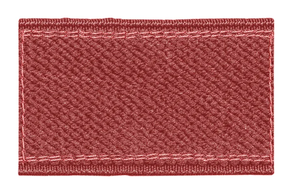 Etiqueta têxtil vermelha em branco — Fotografia de Stock