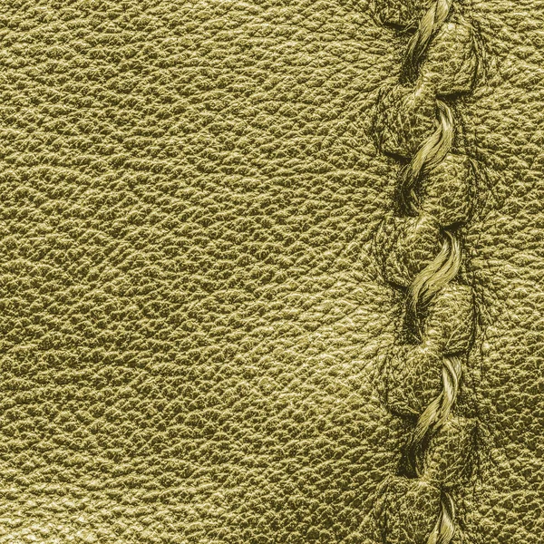 Yellow-green  leather texture decorated with seam — Stock Photo, Image