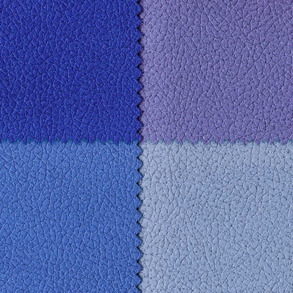 Bakgrund av fyra olika färg bitar av läder — Stockfoto