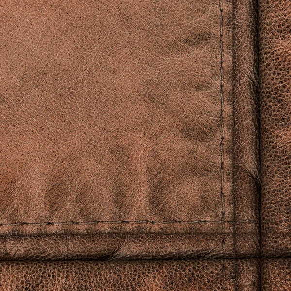 Reddish leather background, seams — Stock Photo, Image