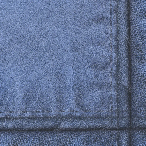 Textura de couro azul decorado com duas costuras — Fotografia de Stock