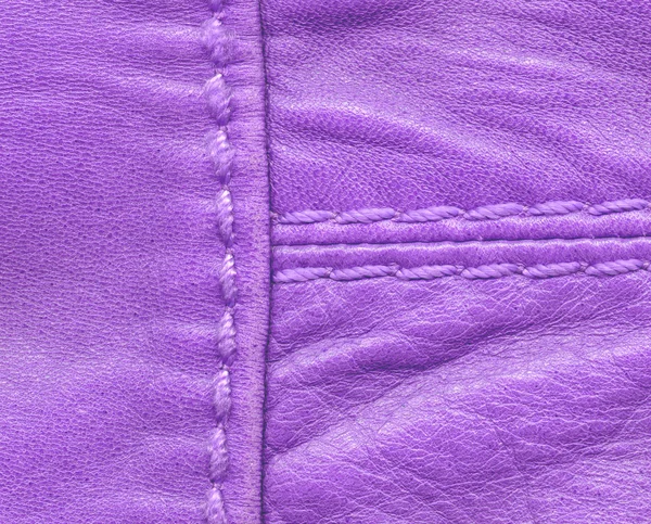 Textura de cuero violeta decorada con dos costuras — Foto de Stock