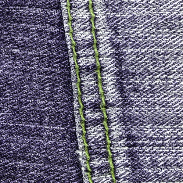 Violet jeans background decorated with seam — Stock Photo, Image