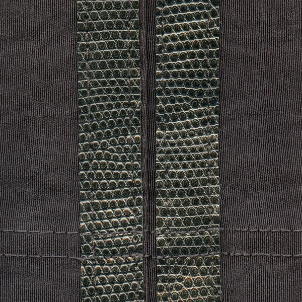 Sötét barna textil textúra bőr betétekkel díszített — Stock Fotó