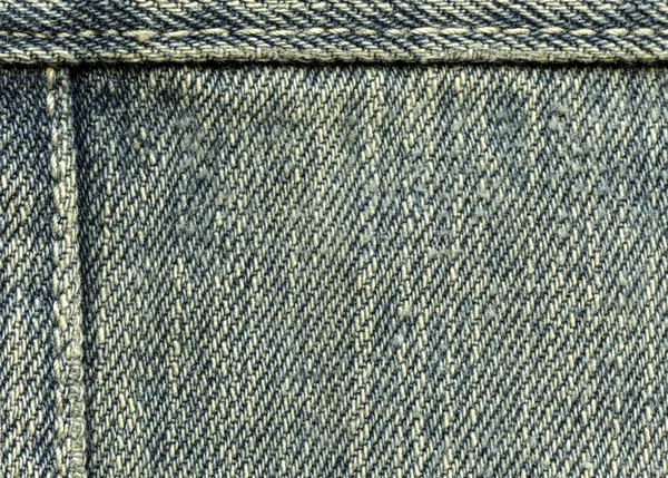 Old and worn blue denim texture, seams — Stock Photo, Image