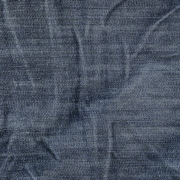 Old and worn  crumpled blue  denim texture — Stock Photo, Image