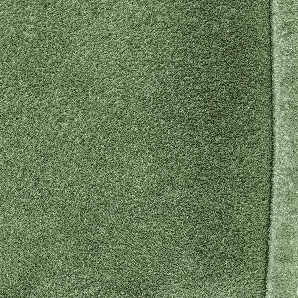 Groene gelooid leder textuur close-up, naad — Stockfoto