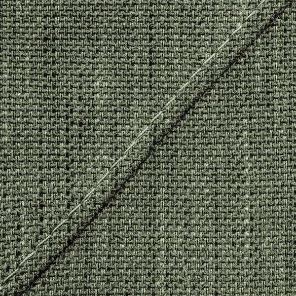 Gray-green tweed texture closeup, seam.stitches — Stock Photo, Image