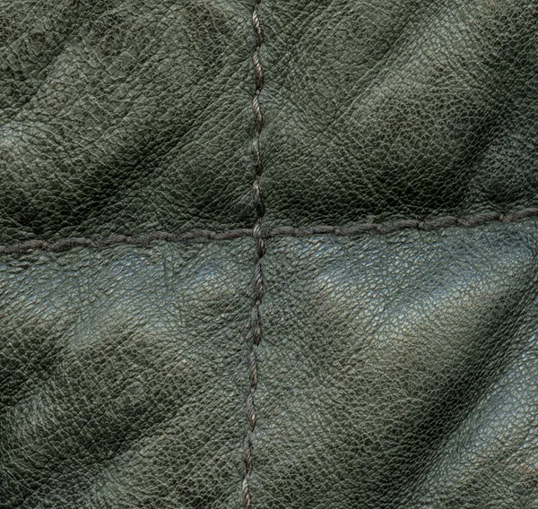 Fragment of greenish leather jacket closeup — Stock Photo, Image