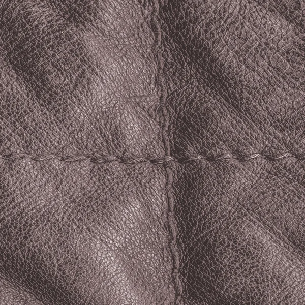 Fragment of brown leather jacket closeup as background — Stock Photo, Image