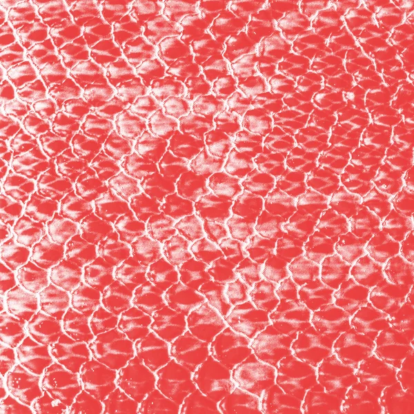 Red textile background as imitation of snake skin pattern — Stock Photo, Image