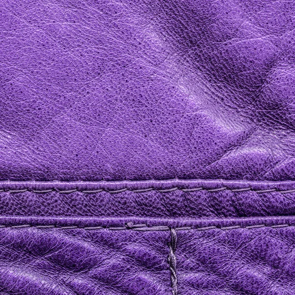 Violet leather background,seams, stitches — Stock Photo, Image