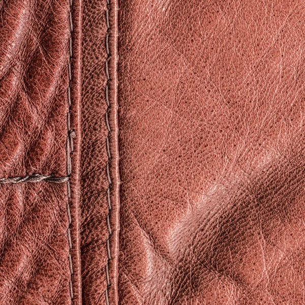 Red-brown leather background,seams, stitches — Stock Photo, Image