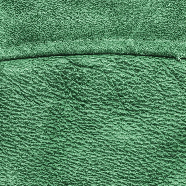 Old green  leather background, seam — Stock Photo, Image