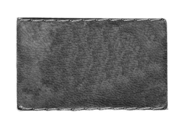 Etiqueta de couro jeans preto em branco isolado no branco — Fotografia de Stock