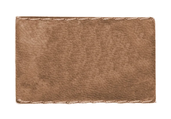 Etiqueta de cuero vaqueros marrón claro aislado en blanco — Foto de Stock