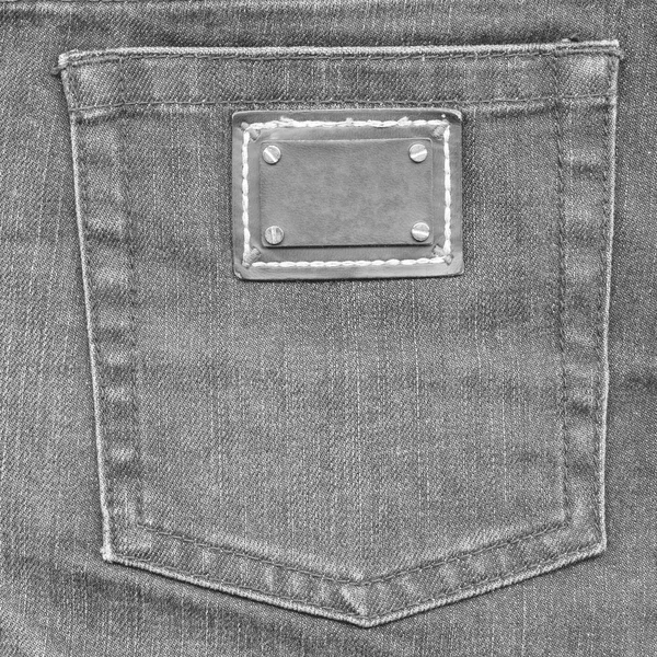Gray jeans back pocket, label — Stock Photo, Image
