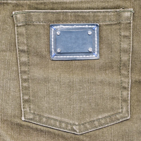 Light brown jeans back pocket, label — Stock Photo, Image