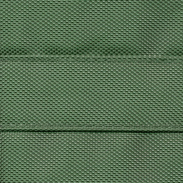 Tekstura zielony syntetyczny materiał zbliżenie — Zdjęcie stockowe
