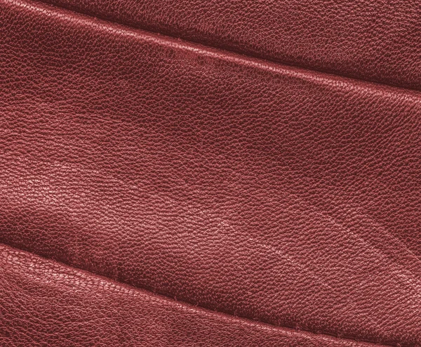 Texture rouge vieux cuir décoré de coutures — Photo