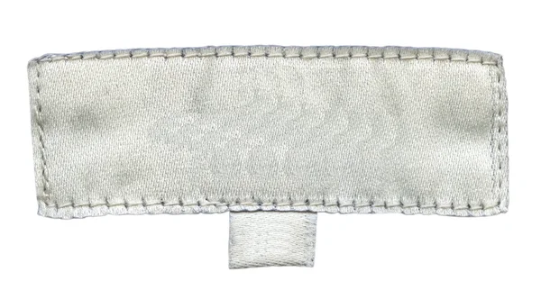 Vecchio tag tessile bianco isolato su sfondo bianco — Foto Stock