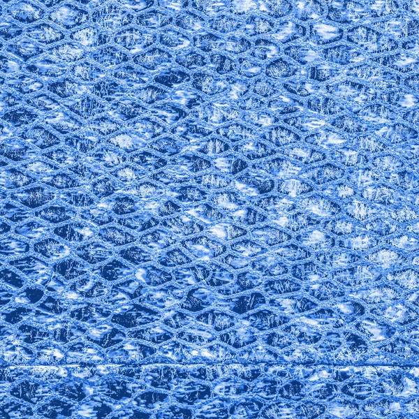 Blå bakgrund av konstgjorda orm hud textur — Stockfoto