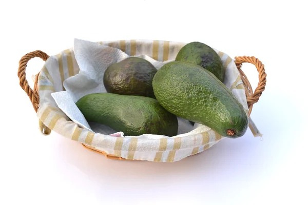 Avocadoes in a basket. — Stock Photo, Image