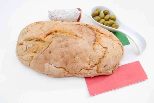 Crusty bread with olives and salami — Stock Photo, Image