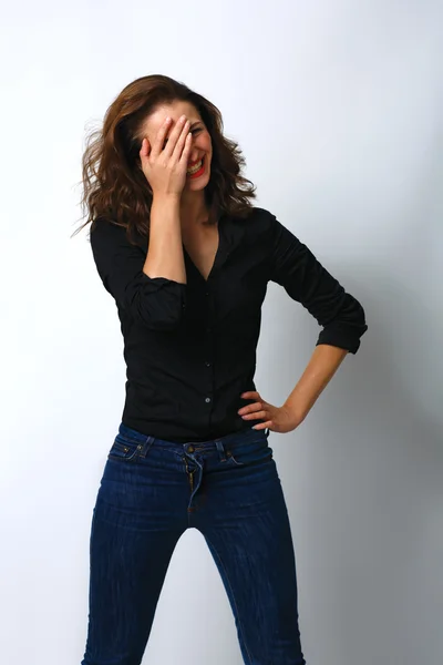 Playful shy woman hiding face laughing timid — Stock Photo, Image