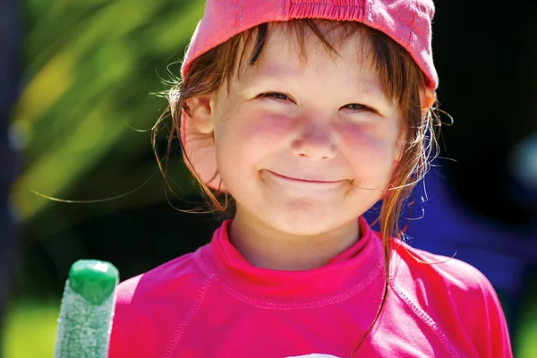 Cheerful girl with ice cream in hand — Stock Photo, Image