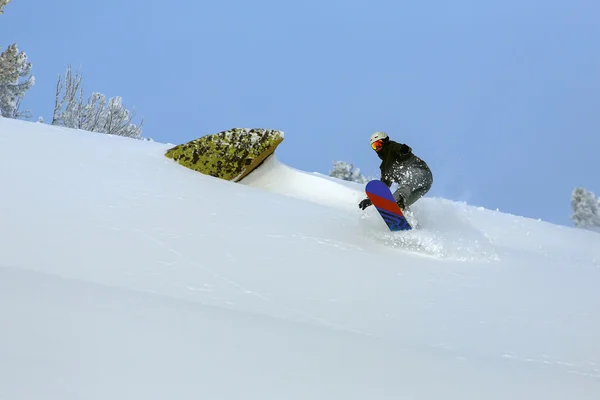 Snowboarder doen een teen kant snijden — Stockfoto