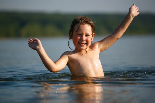 Adorable  baby girl splashing in a beautiful sea — Stock Photo, Image