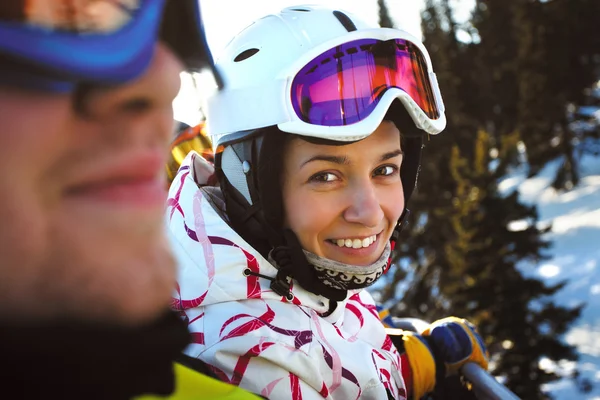 Happy snowboarding girls in winter mountains — Stock Photo, Image