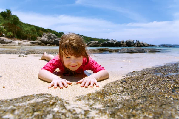 Happy child playing in sea. Summer vacations concept — Stock Photo, Image