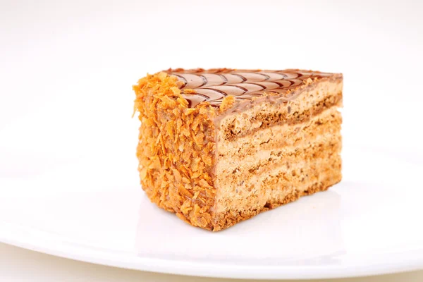 Slice of layered honey cake isolated