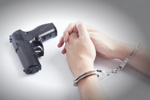 Arrested criminal hands in handcuffs — Stock Photo, Image