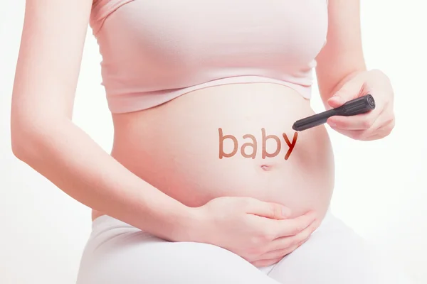 Linda madre embarazada esperando un bebé — Foto de Stock