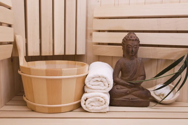 Ayurveda symbols for relaxation and inner beauty,buddha statue in sauna — Stock Photo, Image