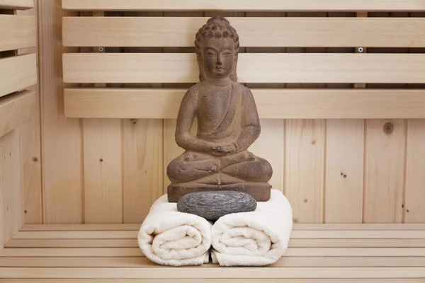 Ayurveda symbols for relaxation and inner beauty,buddha statue in sauna — Stock Photo, Image
