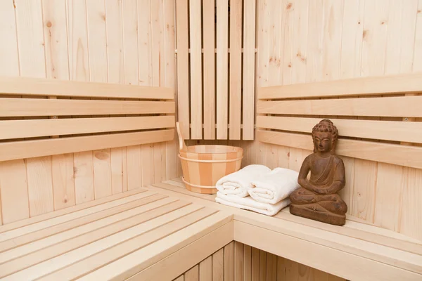 Ayurveda symbolen voor ontspanning en innerlijke schoonheid, Boeddhabeeld in sauna — Stockfoto