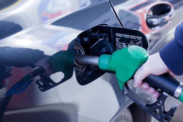Man filling up car with fuel at petrol station Royalty Free Stock Images