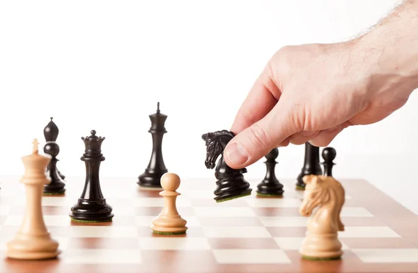 Moving chess pieces on a chessboard — Stock Photo, Image